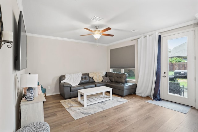 31110 Birch Mills Dr, Hockley, TX 77447 - living area featuring ornamental molding, ceiling fan, light wood finished floors, and baseboards