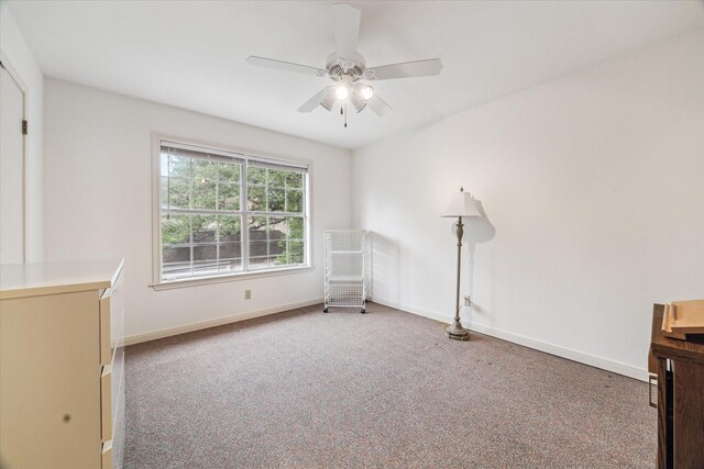 903 Old Lake Rd, Houston, TX 77057 - empty room with carpet floors, a ceiling fan, and baseboards