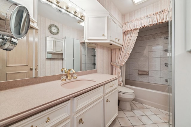 903 Old Lake Rd, Houston, TX 77057 - full bath featuring tile patterned floors, toilet, vanity, and shower / tub combo
