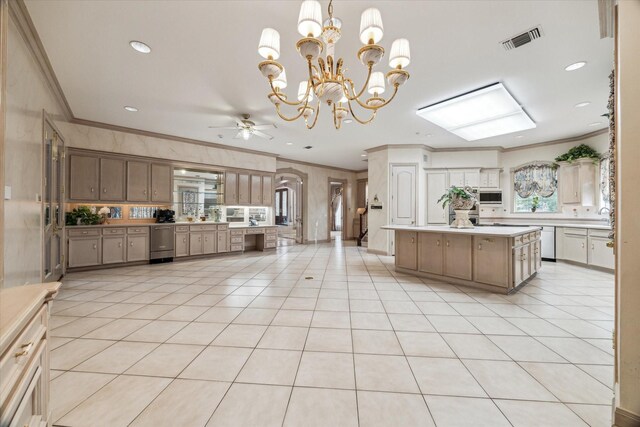 903 Old Lake Rd, Houston, TX 77057 - kitchen with ornamental molding, stainless steel appliances, ceiling fan, light countertops, and a chandelier