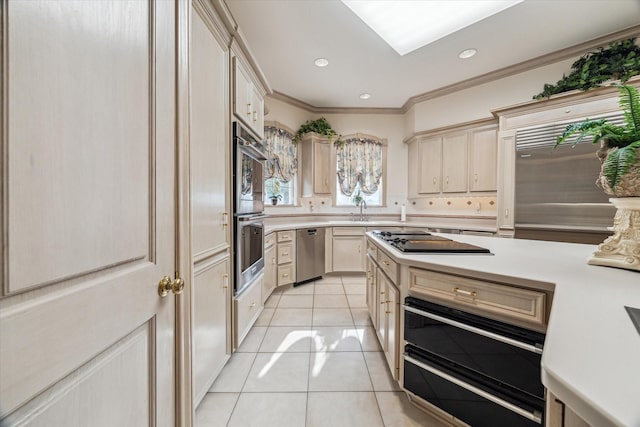 903 Old Lake Rd, Houston, TX 77057 - kitchen featuring appliances with stainless steel finishes, light tile patterned floors, light countertops, a warming drawer, and crown molding