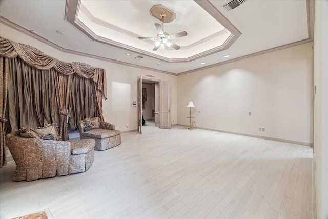903 Old Lake Rd, Houston, TX 77057 - unfurnished living room featuring ornamental molding, a tray ceiling, a ceiling fan, wood finished floors, and baseboards