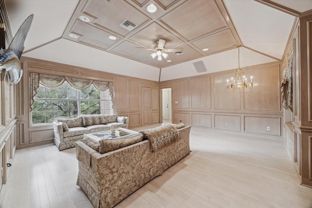 903 Old Lake Rd, Houston, TX 77057 - living area with a decorative wall, a chandelier, a ceiling fan, lofted ceiling, and light wood-style flooring