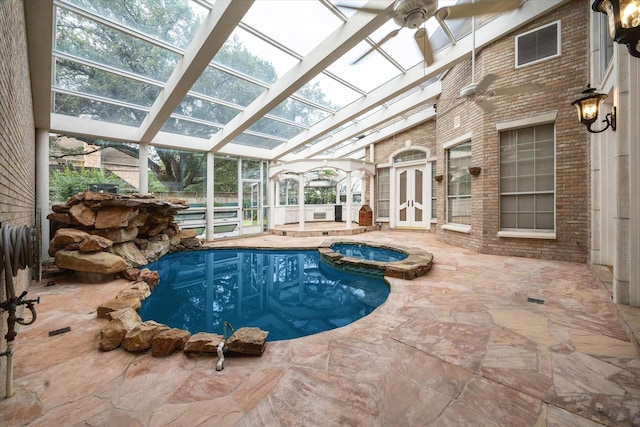 903 Old Lake Rd, Houston, TX 77057 - view of swimming pool featuring a patio area, a pool with connected hot tub, and a lanai