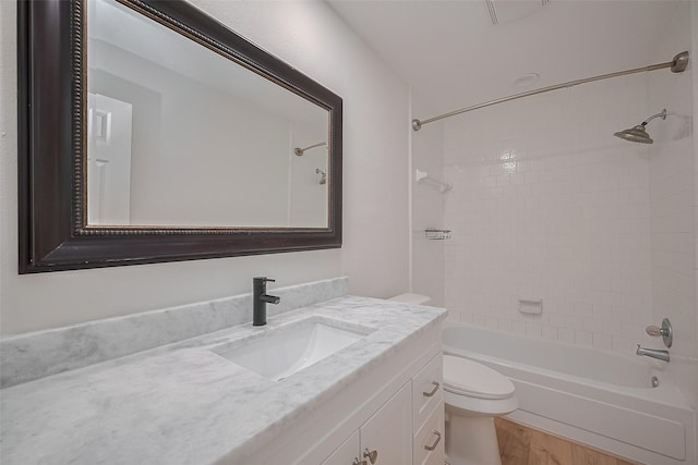 2543 Forge Stone Dr, Friendswood, TX 77546 - bathroom featuring toilet, vanity, tub / shower combination, and wood finished floors