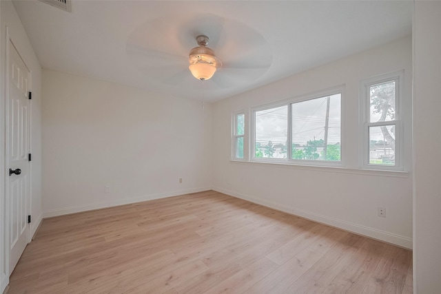 2543 Forge Stone Dr, Friendswood, TX 77546 - unfurnished bedroom with light wood-style flooring, baseboards, and ceiling fan