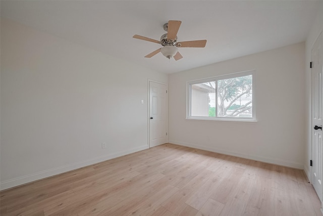 2543 Forge Stone Dr, Friendswood, TX 77546 - empty room featuring light wood finished floors, baseboards, and ceiling fan