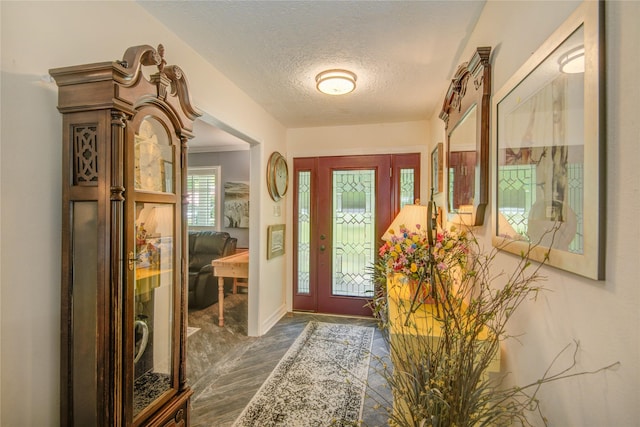 16814 Creeksouth Rd, Houston, TX 77068 - entrance foyer with a textured ceiling, baseboards, and wood finished floors