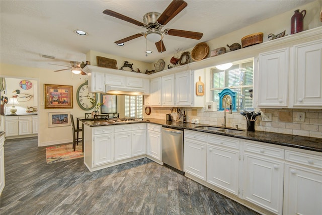 16814 Creeksouth Rd, Houston, TX 77068 - kitchen with stainless steel dishwasher, a ceiling fan, a sink, a peninsula, and dark wood-type flooring