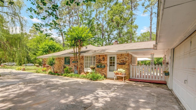 16814 Creeksouth Rd, Houston, TX 77068 - view of front facade featuring a chimney and brick siding