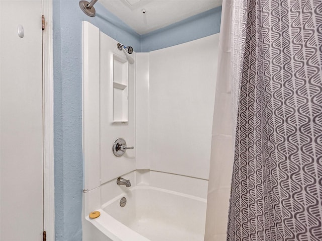 6300 Seawall Blvd Unit 3123, Galveston, TX 77551 - bathroom with shower / tub combo and a textured wall