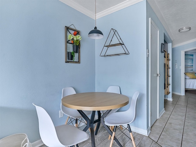 6300 Seawall Blvd Unit 3123, Galveston, TX 77551 - dining space with baseboards, crown molding, and light tile patterned floors