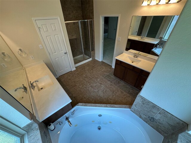 9314 Wheatfield Ln, Rosenberg, TX 77469 - bathroom with a shower stall, two vanities, and a whirlpool tub