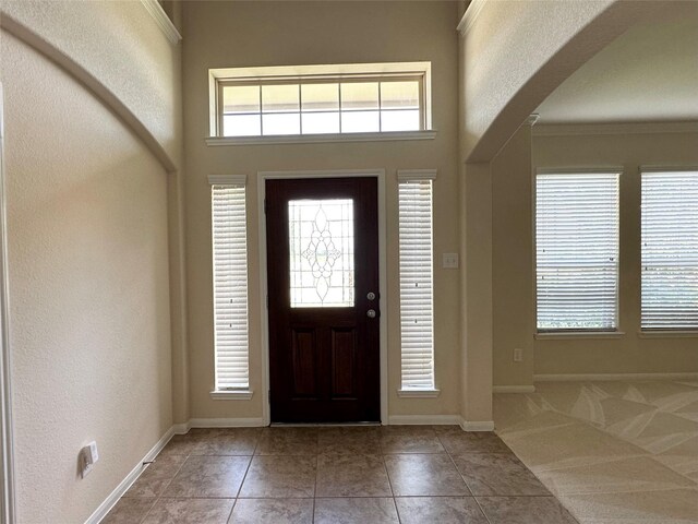 9314 Wheatfield Ln, Rosenberg, TX 77469 - tiled entrance foyer featuring arched walkways and baseboards