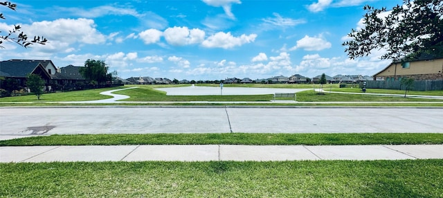 9314 Wheatfield Ln, Rosenberg, TX 77469 - view of concrete road featuring sidewalks and a residential view