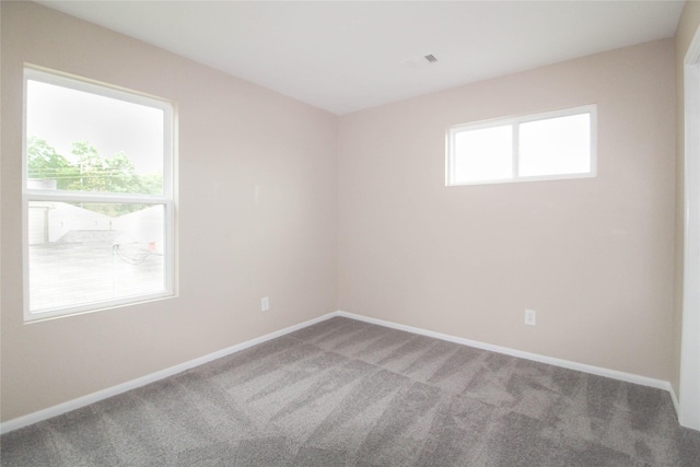 16726 Warbler Dr, Conroe, TX 77385 - carpeted empty room featuring baseboards