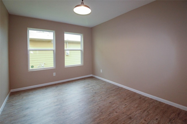 16726 Warbler Dr, Conroe, TX 77385 - unfurnished room with wood finished floors and baseboards