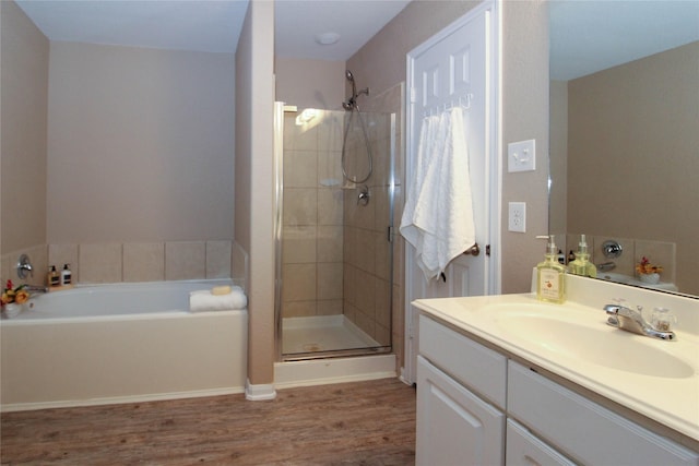 16726 Warbler Dr, Conroe, TX 77385 - full bath featuring a shower stall, vanity, wood finished floors, and a bath