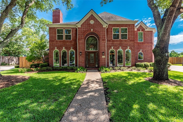 5706 Amber Queen Ct, Houston, TX 77041 - colonial home featuring a chimney and brick siding