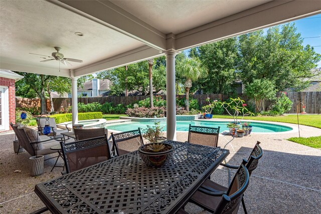 5706 Amber Queen Ct, Houston, TX 77041 - fenced backyard featuring outdoor dining space, a patio area, ceiling fan, and an in-ground hot tub