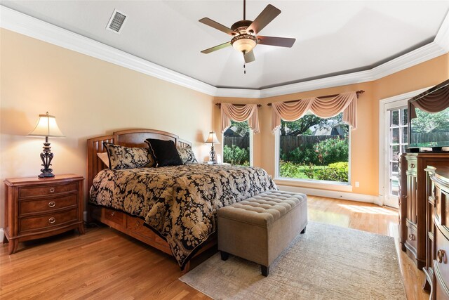 5706 Amber Queen Ct, Houston, TX 77041 - bedroom featuring wood finished floors, access to exterior, ornamental molding, and ceiling fan