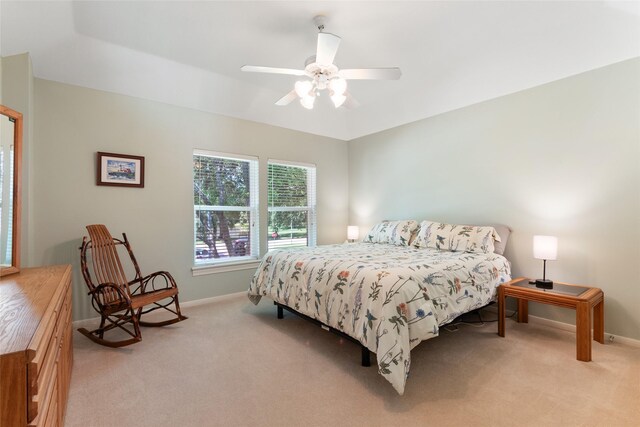 5706 Amber Queen Ct, Houston, TX 77041 - bedroom featuring light carpet, baseboards, and a ceiling fan