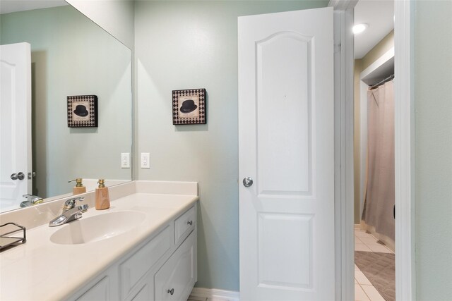 5706 Amber Queen Ct, Houston, TX 77041 - full bathroom featuring vanity, tile patterned flooring, baseboards, and a shower with curtain