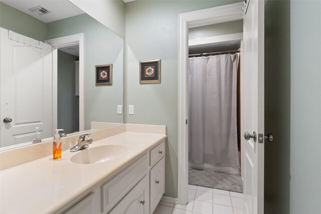 5706 Amber Queen Ct, Houston, TX 77041 - bathroom with vanity, tile patterned flooring, a shower with curtain, and baseboards
