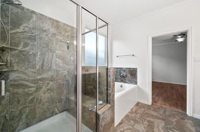 910 S Chamfer Way, Crosby, TX 77532 - bathroom with a garden tub, a shower stall, ornamental molding, and baseboards