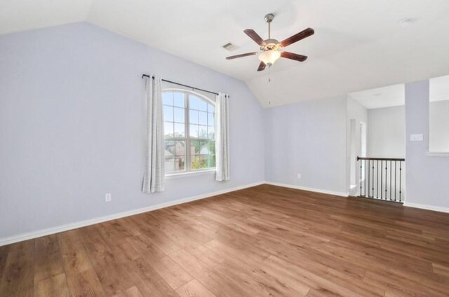 910 S Chamfer Way, Crosby, TX 77532 - additional living space featuring lofted ceiling, a ceiling fan, wood finished floors, and baseboards