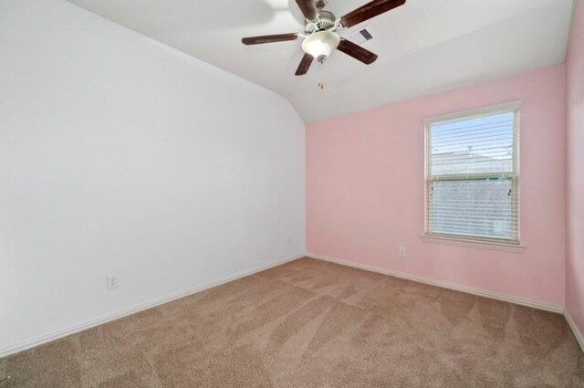 910 S Chamfer Way, Crosby, TX 77532 - unfurnished room with light carpet, vaulted ceiling, ceiling fan, and baseboards