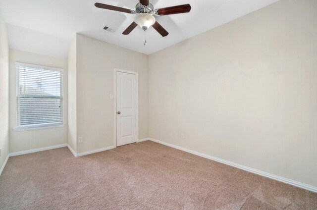910 S Chamfer Way, Crosby, TX 77532 - carpeted empty room with baseboards and a ceiling fan