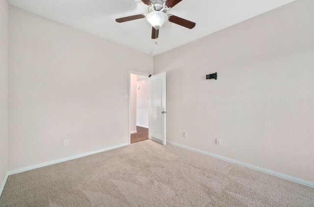 910 S Chamfer Way, Crosby, TX 77532 - carpeted empty room with a ceiling fan and baseboards