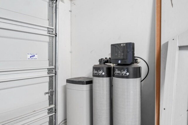 910 S Chamfer Way, Crosby, TX 77532 - garage view of a water softener