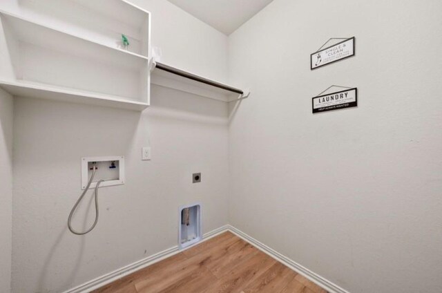 910 S Chamfer Way, Crosby, TX 77532 - washroom with light wood-style flooring, hookup for a washing machine, baseboards, and hookup for an electric dryer