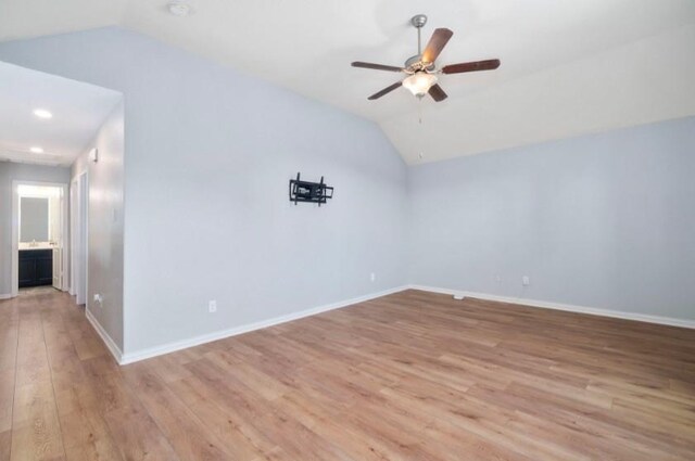 910 S Chamfer Way, Crosby, TX 77532 - additional living space with vaulted ceiling, ceiling fan, light wood-style floors, and baseboards