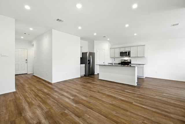 40518 Crisp Beech St, Magnolia, TX 77354 - kitchen featuring stainless steel appliances, open floor plan, dark wood-style floors, recessed lighting, and a sink