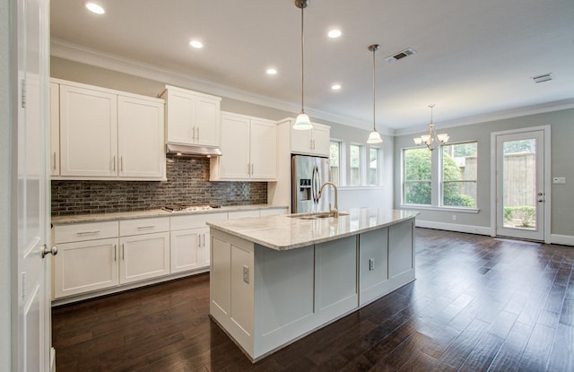 5726 Brancott Way, Houston, TX 77096 - kitchen with stainless steel appliances, a sink, under cabinet range hood, backsplash, and a center island with sink