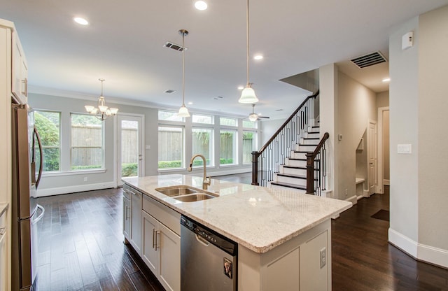 5726 Brancott Way, Houston, TX 77096 - kitchen featuring stainless steel appliances, a sink, baseboards, dark wood finished floors, and plenty of natural light