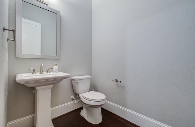 5726 Brancott Way, Houston, TX 77096 - bathroom with wood finished floors, toilet, and baseboards