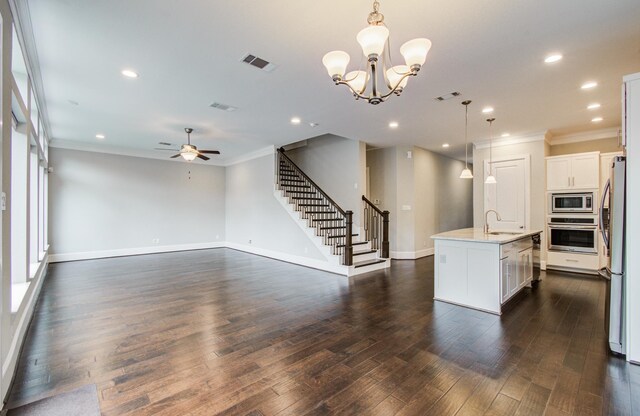 5726 Brancott Way, Houston, TX 77096 - kitchen with stainless steel appliances, a sink, ornamental molding, a ceiling fan, and dark wood-style flooring