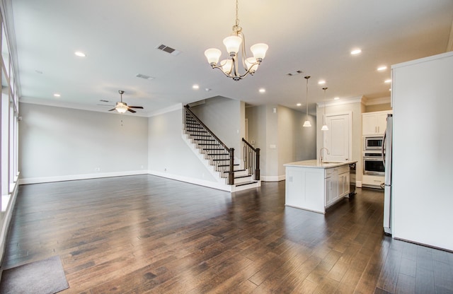 5726 Brancott Way, Houston, TX 77096 - kitchen featuring appliances with stainless steel finishes, a sink, light countertops, ceiling fan, and an island with sink