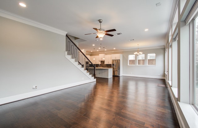 5726 Brancott Way, Houston, TX 77096 - unfurnished living room with ornamental molding, a ceiling fan, baseboards, a chandelier, and stairway