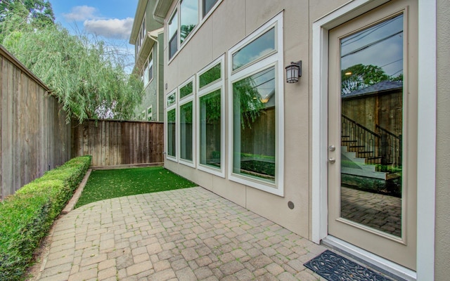 5726 Brancott Way, Houston, TX 77096 - fenced backyard featuring a patio and stairway
