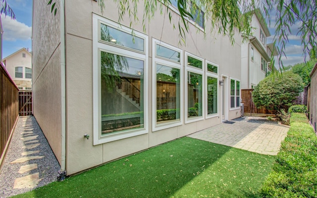 5726 Brancott Way, Houston, TX 77096 - rear view of property featuring stucco siding and a patio area