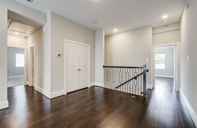 5726 Brancott Way, Houston, TX 77096 - corridor featuring an upstairs landing, attic access, dark wood finished floors, baseboards, and recessed lighting
