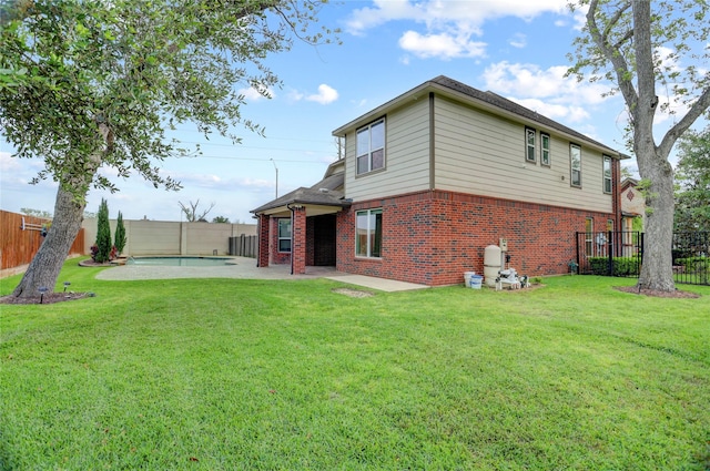 5402 Bending Branch Dr, Missouri City, TX 77459 - rear view of house with brick siding and a patio area