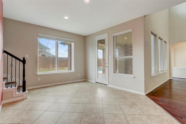 5402 Bending Branch Dr, Missouri City, TX 77459 - spare room with recessed lighting, stairway, baseboards, and tile patterned floors