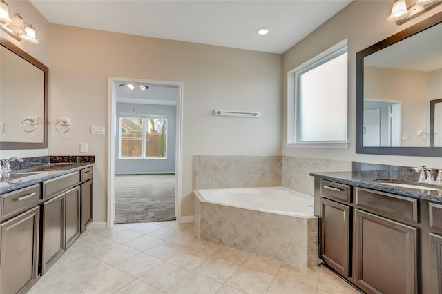 5402 Bending Branch Dr, Missouri City, TX 77459 - bathroom featuring healthy amount of natural light, tile patterned floors, and two vanities