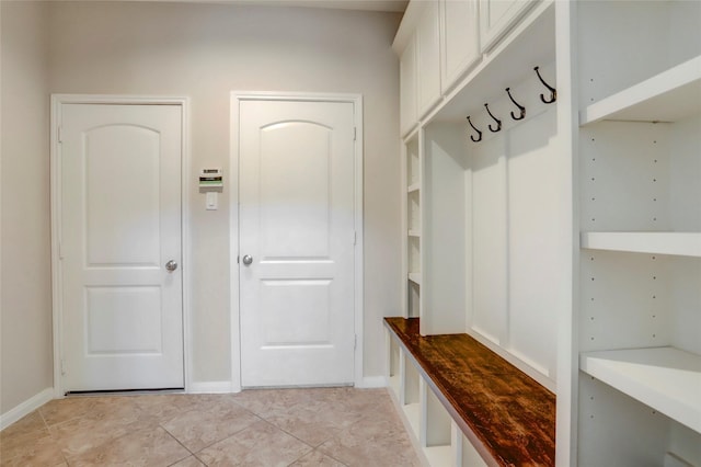 5402 Bending Branch Dr, Missouri City, TX 77459 - mudroom featuring baseboards and light tile patterned floors
